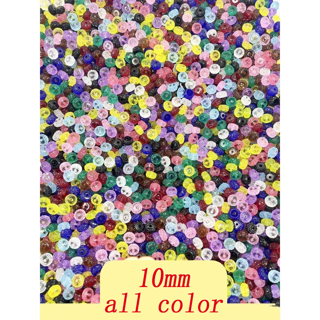 A collection of multicolored acrylic beads with a sugar spacer texture on one side, displayed on a white surface.

