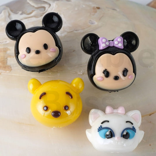 Three cartoon character figurines on a textured surface with 'beadablebliss.com' branding.
