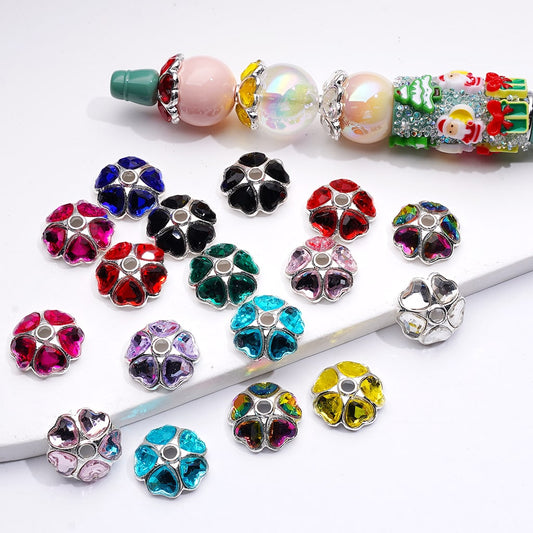 Colorful flower-shaped beads on a white background

