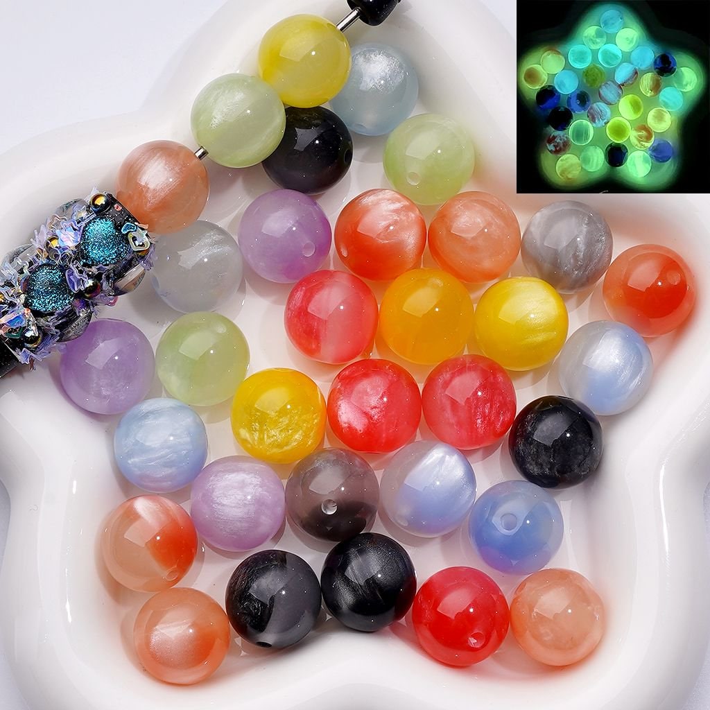 Colorful beads on a white plate with a close-up inset showing their glow under UV light.

