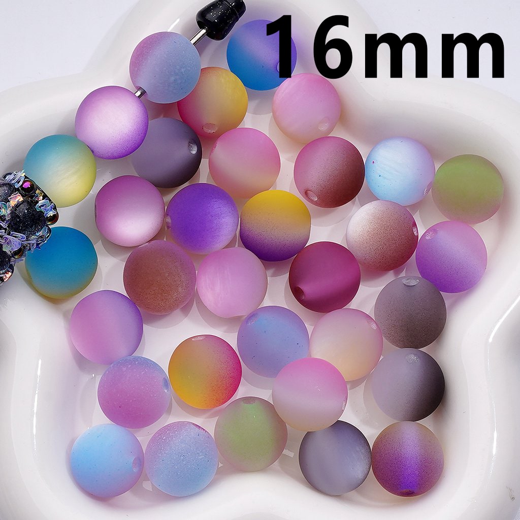 Multicolored beads on a white plate with '16 mm' text

