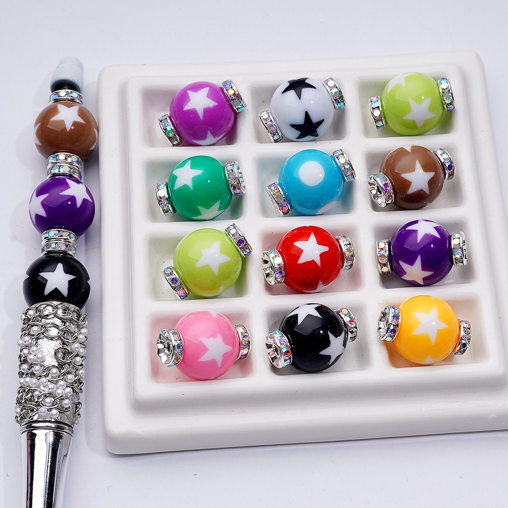 Colorful beaded bracelet with star designs on a white background

