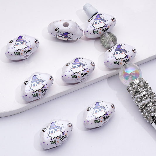 Decorative beads with cartoon character designs on a white surface

