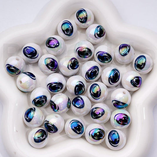 Iridescent glass beads on a white background


