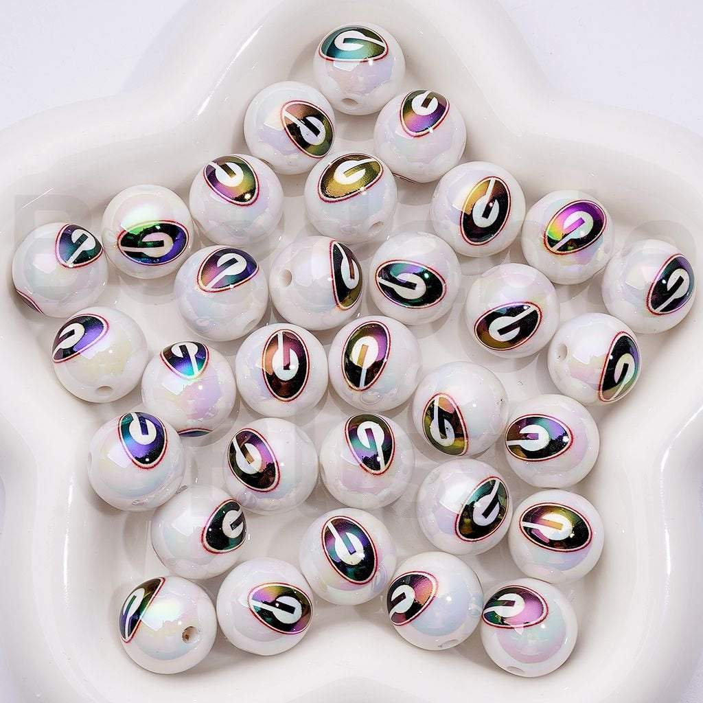White beads with multicolored '2?' pattern on a white background

