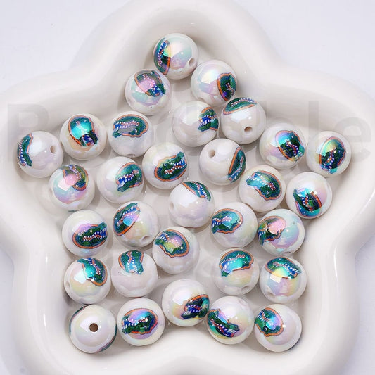 White beads with colorful mermaid scale patterns on a white background

