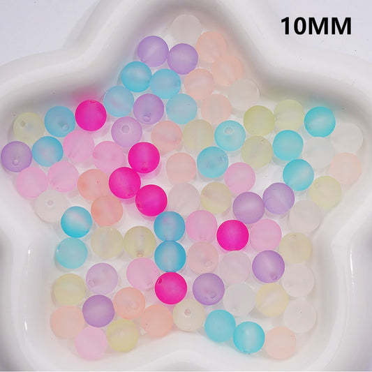 Pastel-colored beads on a white star-shaped tray with '10MM' text.

