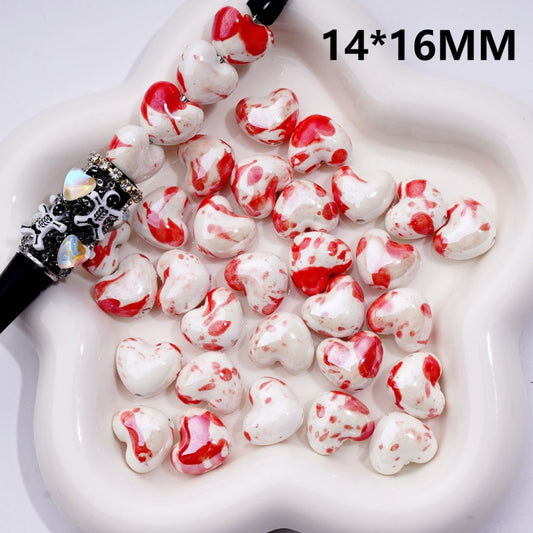 White and red heart-shaped beads with a black and silver bead on a white background, labeled '14*16MM'.

