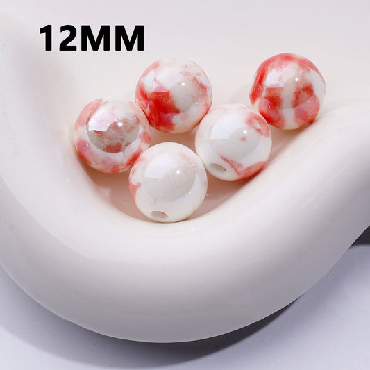 White and red marbled beads with '12MM' text on a white background

