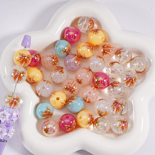 Colorful bubblegum beads with floral designs on a white heart-shaped tray

