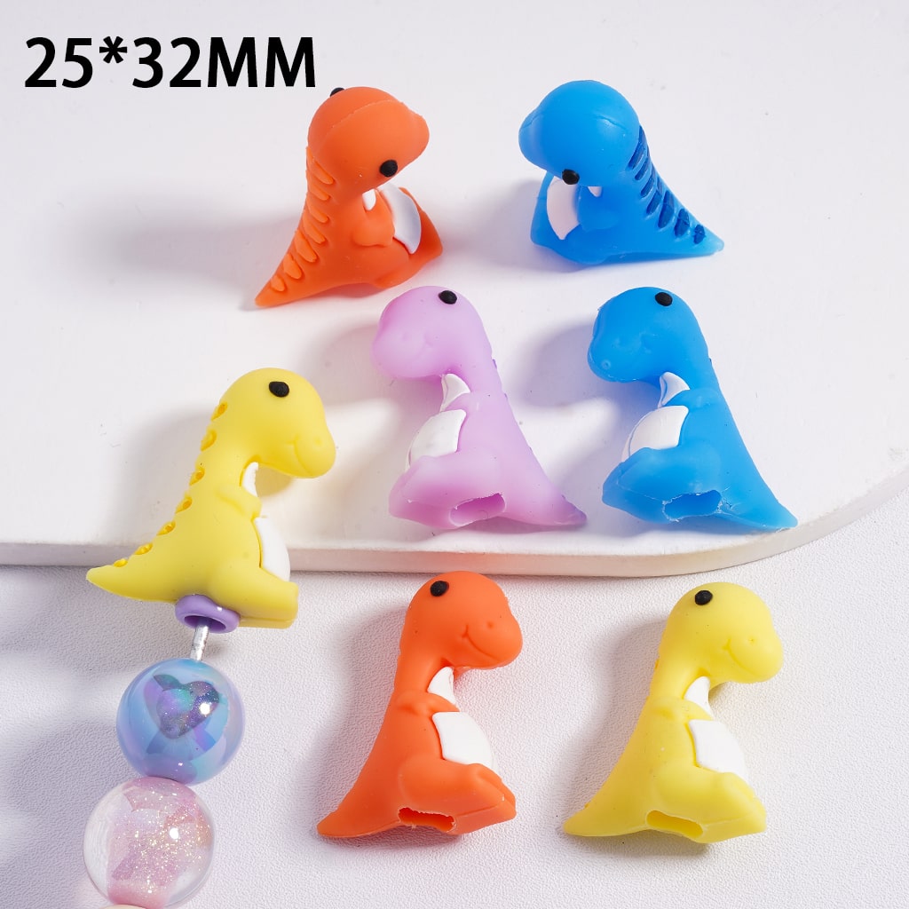 Colorful dinosaur-shaped clips on a white background with dimensions 25*32MM.

