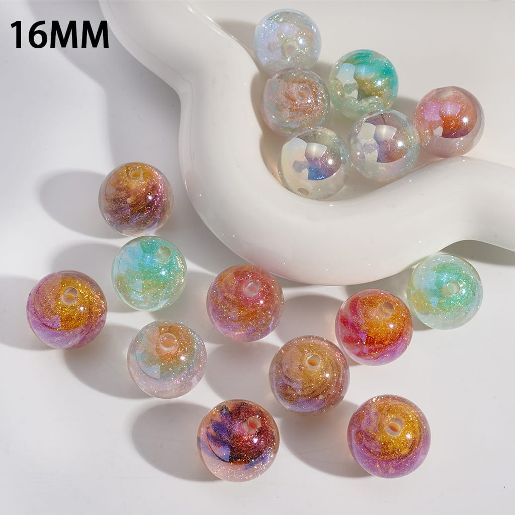Multicolored beads with a white container on a light background