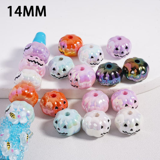 Assorted colorful beads with Halloween designs on a white background

