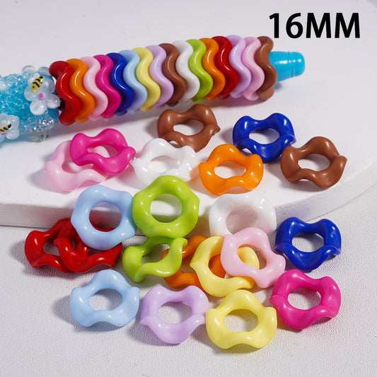 Colorful plastic rings on a white background with '16MM' text.

