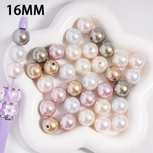 Assorted colored pearls on a white dish with '16MM' text
