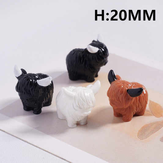 Four small animal figurines in black, white, and brown on a light surface with 'H:20MM' text.