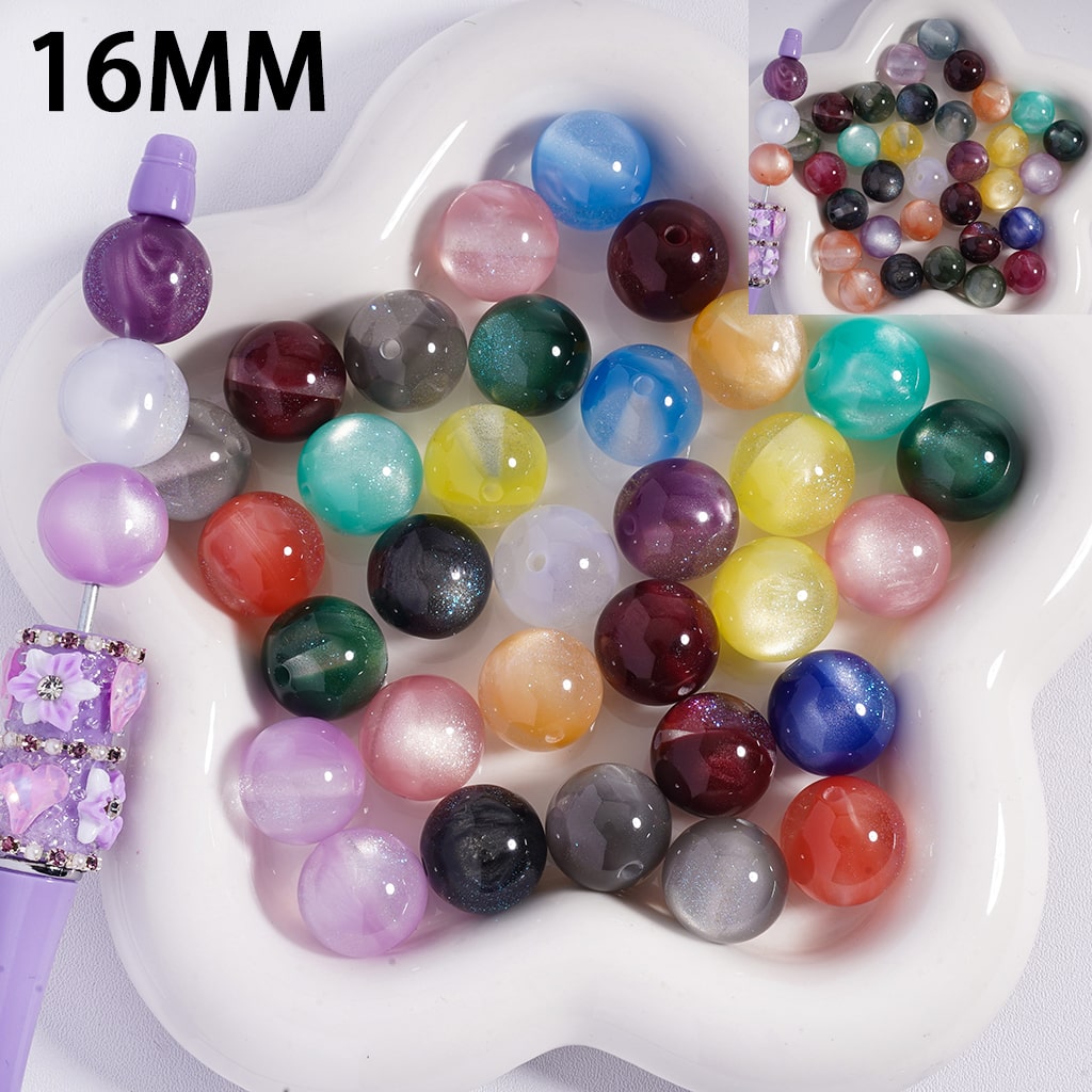 Assorted colored beads on a white plate with '16MM' text