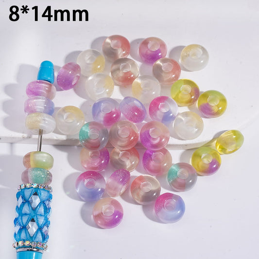 Colorful beads with a blue decorative item on a white background
