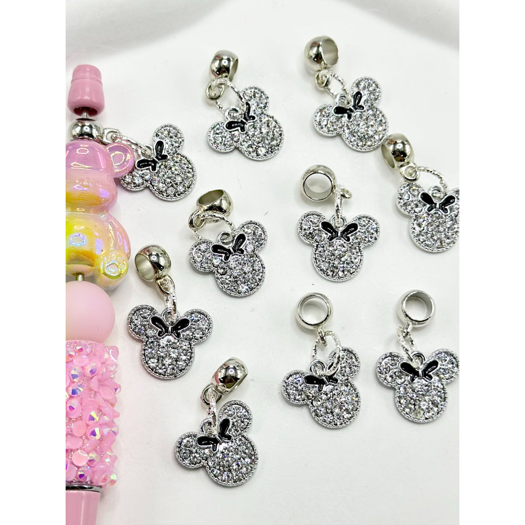 A collection of clear rhinestone charms shaped like mouse heads, intended to be used as pen dangles or embellishments.


