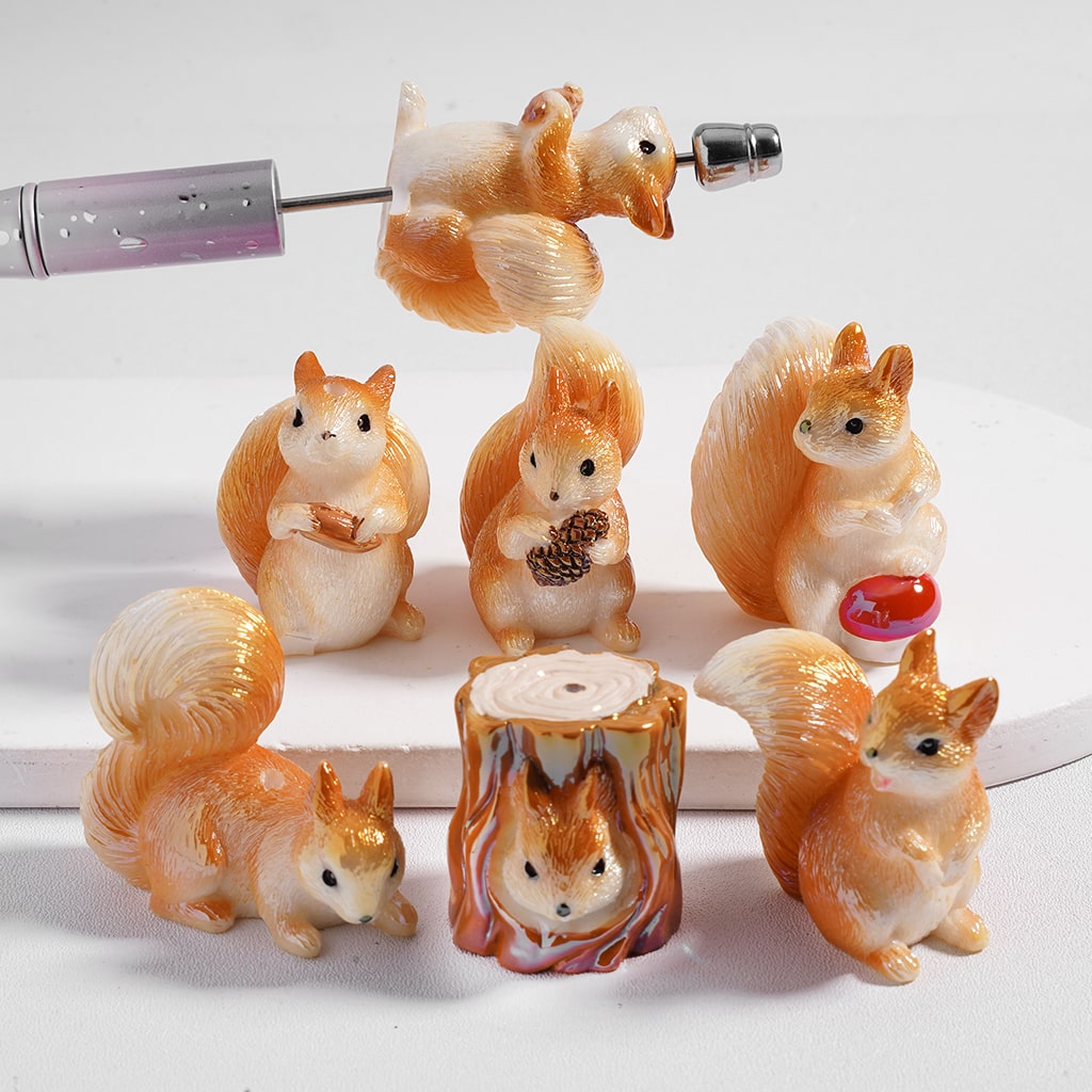 Set of squirrel figurines with various poses on a white background
