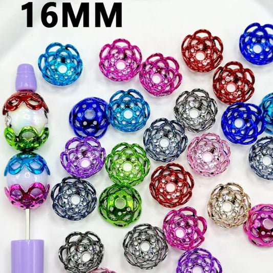 A collection of multicolored acrylic flower bead caps displayed in solid colors with a pair of beading pliers.

