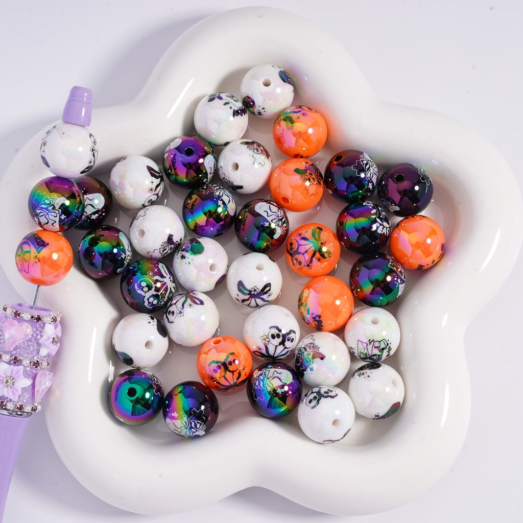 Colorful beaded bracelets with various designs on a white heart-shaped dish.

