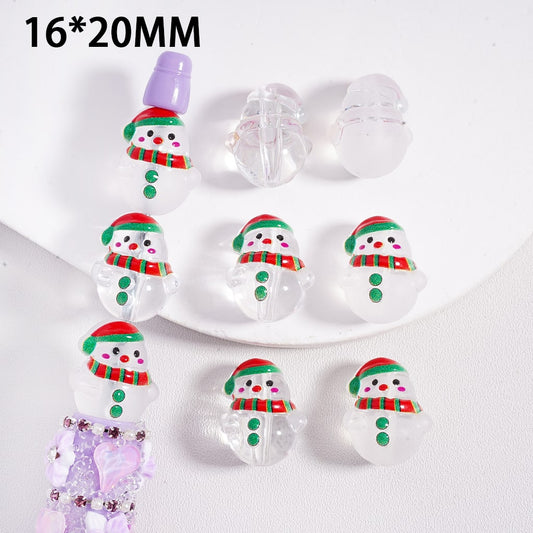 Clear snowman-shaped beads with colorful details on a white background

