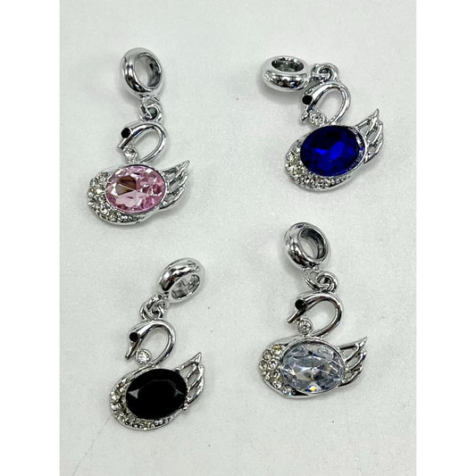 A collection of alloy swan beads with jump rings and rhinestone pendants in various colors including black, pink, blue, and clear.

