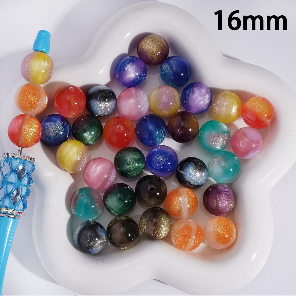 Assorted colored beads on a white dish with a blue tool, labeled '16mm'.