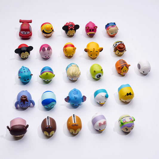 A collection of various character-themed pen toppers, featuring different designs and colors.


