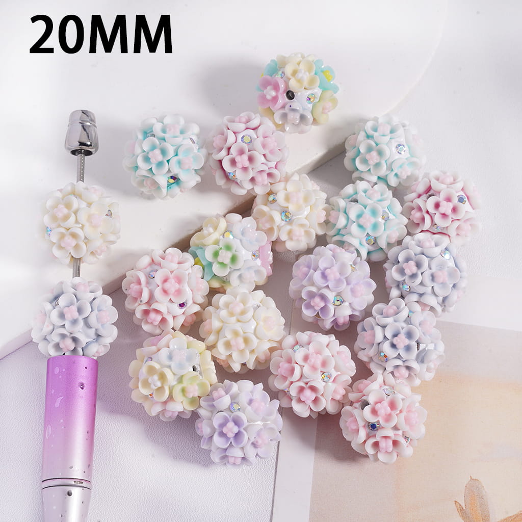 Decorative flower embellishments with a tool on a white background, labeled '20MM'.
