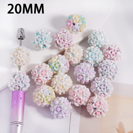 Decorative flower embellishments with a tool on a white background, labeled '20MM'.