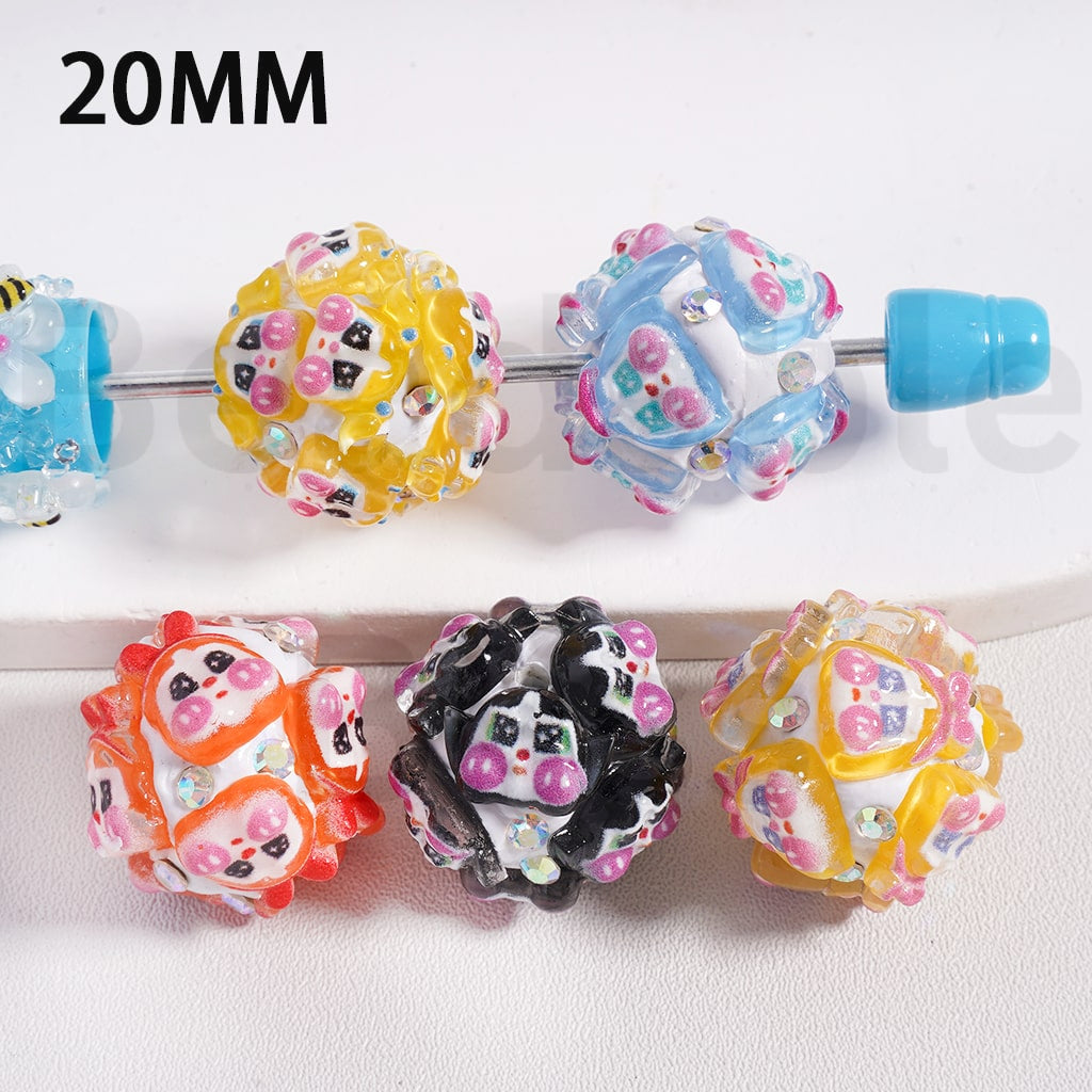 Colorful bead-style hair clips on a white background

