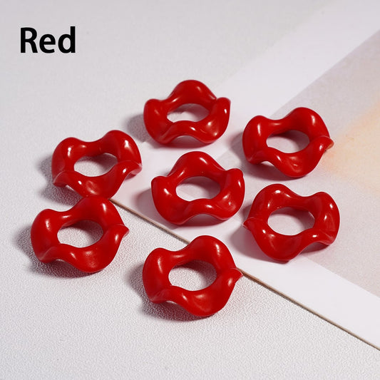 Red lip-shaped objects on a light gray background


