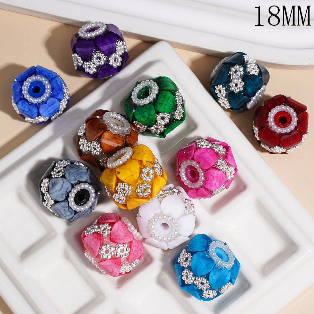 Nine colorful flower-shaped beads, each 18mm in size, arranged on a white segmented tray. The beads feature textured fabric petals and silver rhinestone accents, shown in a variety of colors including blue, green, purple, red, yellow, pink, and white.

