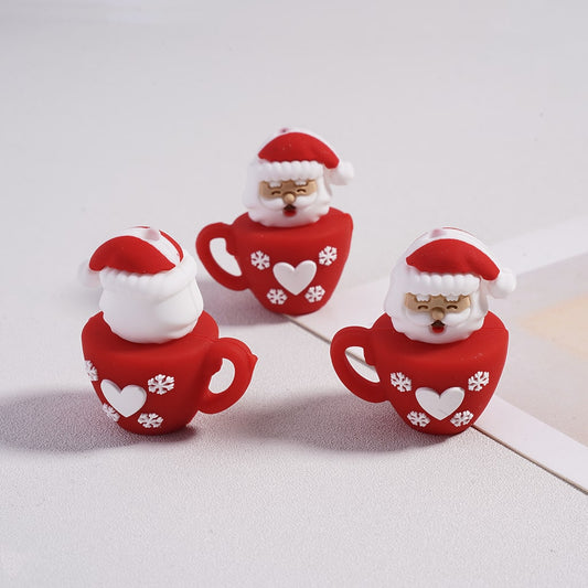 Three red Santa Claus mugs with white snowflake patterns on a light gray background


