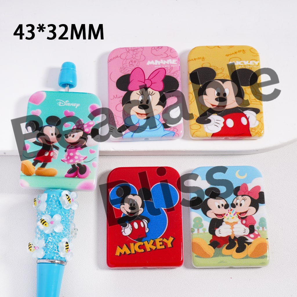 Set of colorful Disney-themed products including a hairbrush and hair ties on a white background.