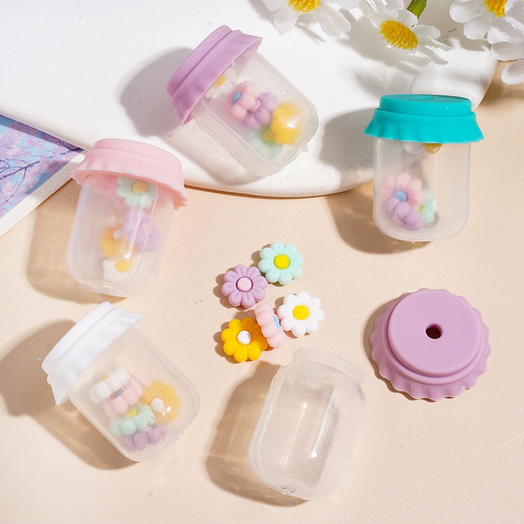 Clear Silicone Shaker Beads with Various Colored Lids and Flowers Embedded Inside the Bottle, Height 27MM