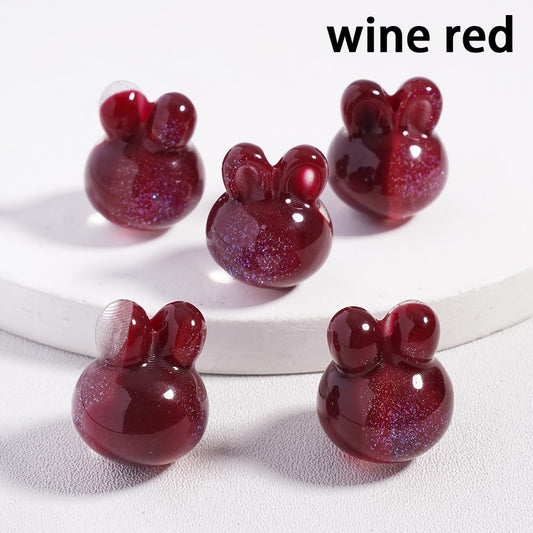 Wine red mouse-shaped objects on a white background

