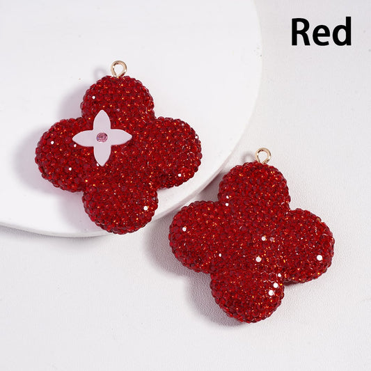 Red floral earrings on a white background with 'Red' text.


