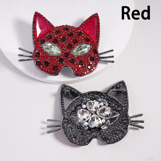 Two cat-shaped hair clips, one red and one black, on a white background.

