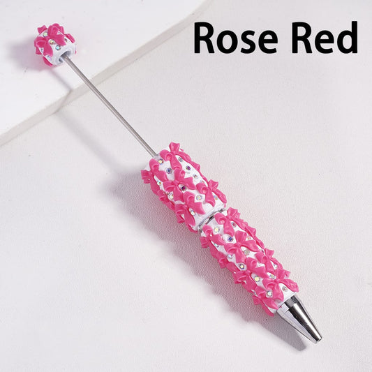 Rose red decorative pen with floral design on a white background

