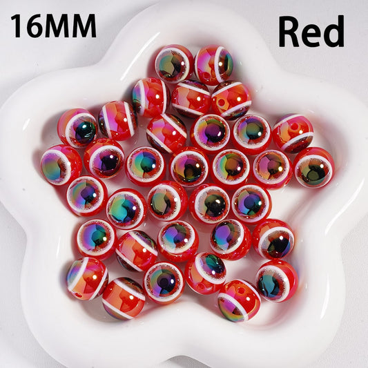 16MM red beads with multicolor iridescent centers on a white heart-shaped dish.

