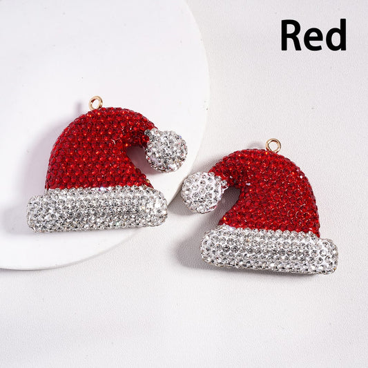 Red and silver Santa hat earrings on a white background

