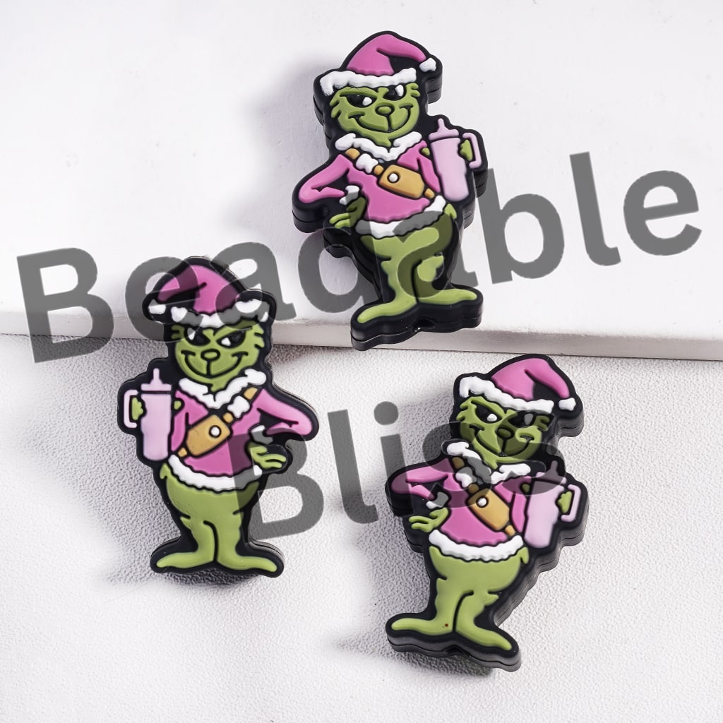 Green Character in a Pink Christmas Hat Holds a Cup Bottle Silicone Focal Beads