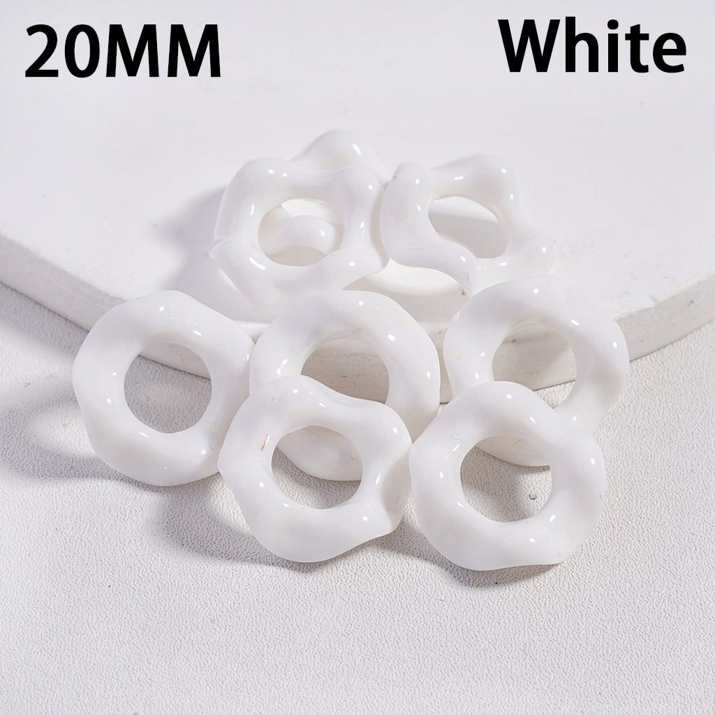 White plastic rings with '20MM' and 'White' text on a light gray background