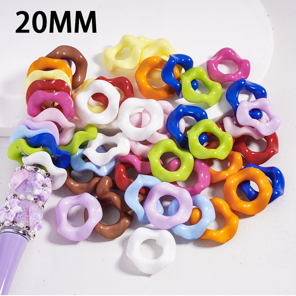 Assorted colorful plastic rings with a purple tool on a white background, labeled '20MM'.