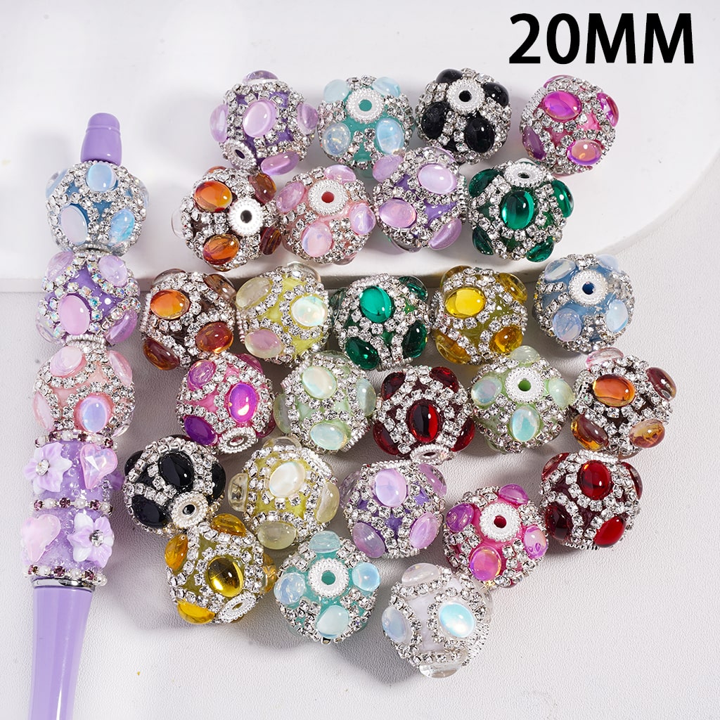 Assorted colorful beads with a purple tool on a white background, labeled '20MM'.