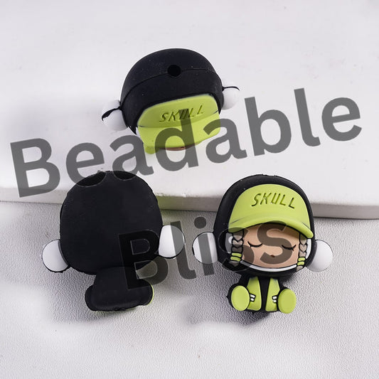 Decorative skull figurines with 'SKULL' hats on a white background, branded 'beadablebliss'
