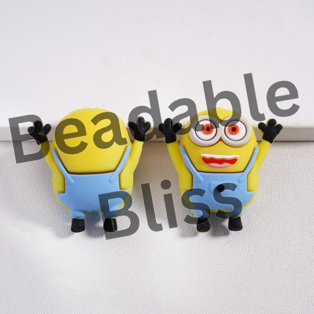 Two cartoon character figures with googly eyes and blue overalls on a white background.
